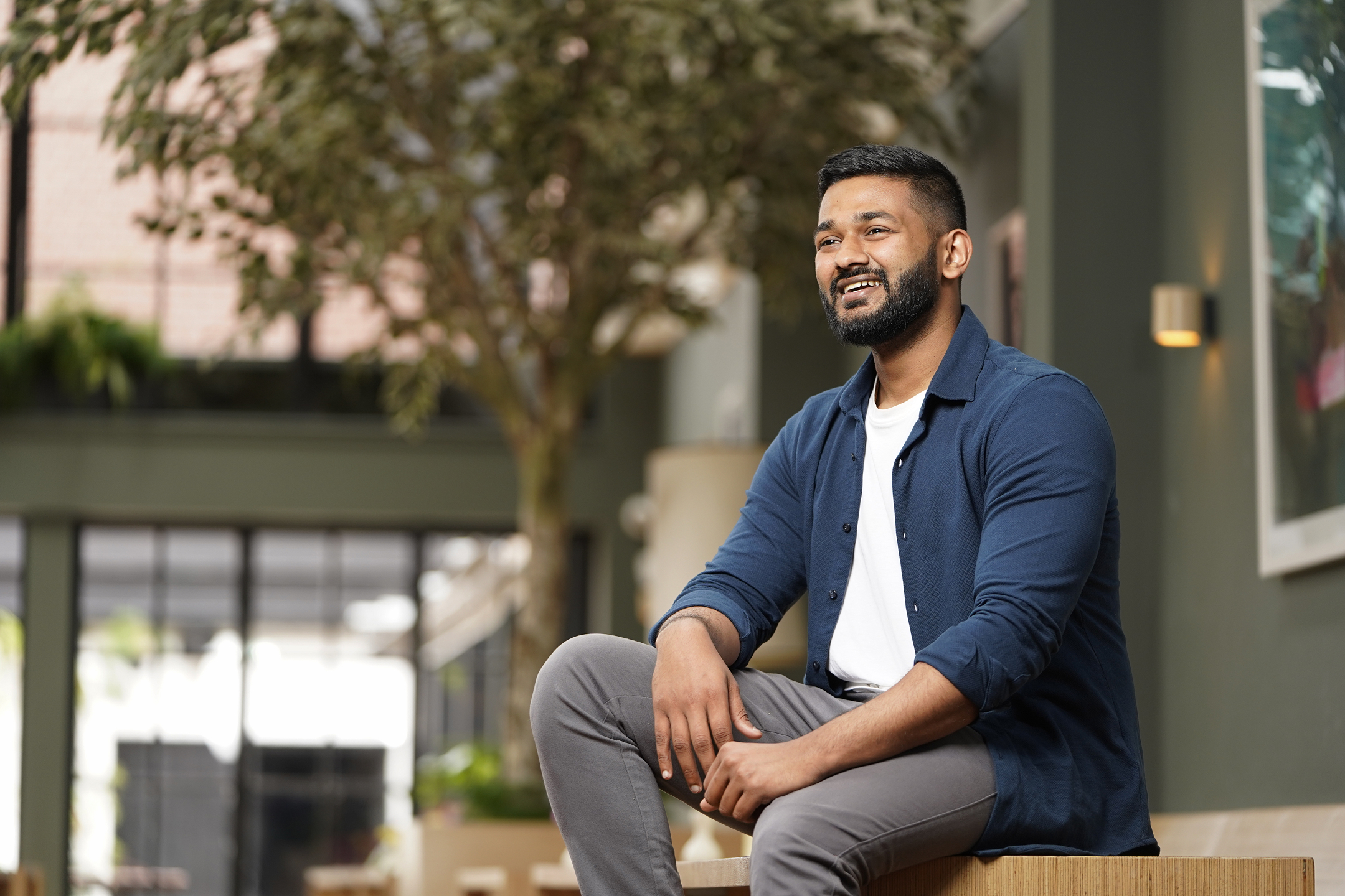 Man sitting down smiling